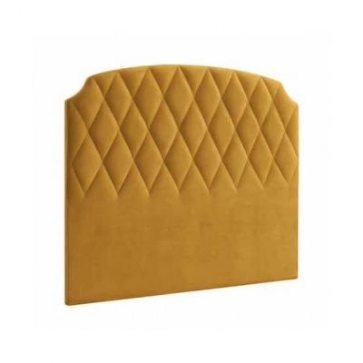 Cabeceira de cama amarelo ocre com padrão em losangos acolchoados