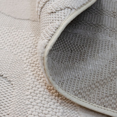 Tapete bege e creme com textura.