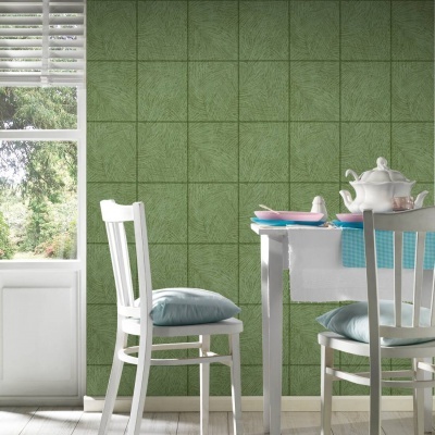 Mesa de jantar branca com pratos cor-de-rosa e bule branco junto a cadeira com almofada azul e parede verde quadriculada