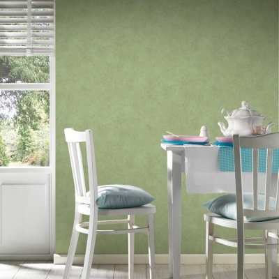 Mesa de jantar branca com louça colorida e cadeiras com almofadas azuis