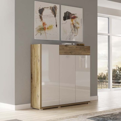 Móvel de arrumação moderno com portas brancas e madeira clara