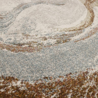 Tapete felpudo com padrão abstrato azul, bege e castanho