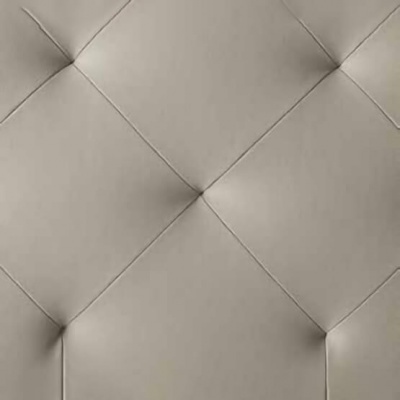 Superfície acolchoada em padrão de losangos bege claro