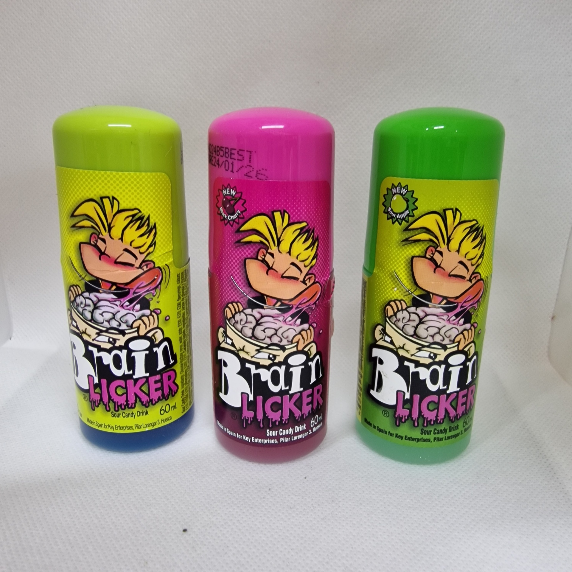Três frascos coloridos de doces Brain Licker com ilustração de criança lambendo