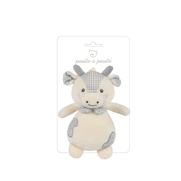 Peluche Musical Vaca Little Bloom da Pasito a pasito Pelúcia de vaca bebé em bege e cinzento com laço, em cartão branco com texto