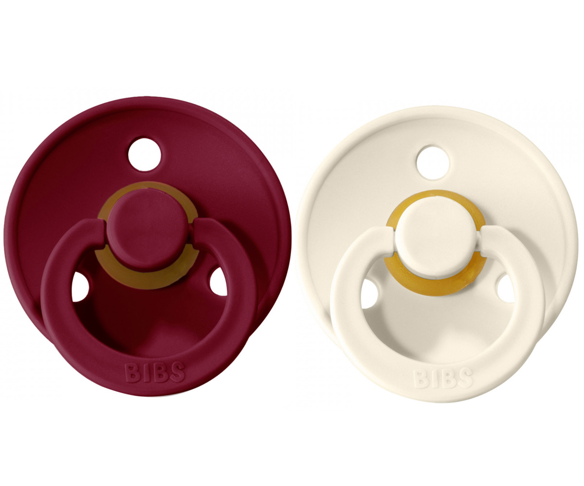 Chupeta Bibs Ivory/Ruby Dois chupetas BIBS vermelho bordeaux e branco com tetinas em silicone