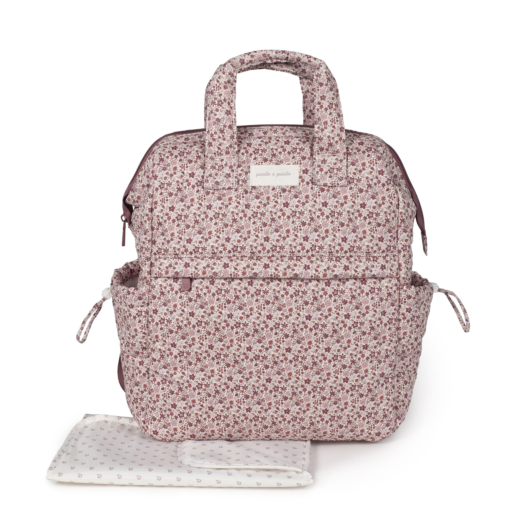 Mochila de Maternidade Cherry Flowers - Rosa Cereja Pasito a Pasito Mala mochila com padrão floral cor-de-rosa e vermelha com alças e fecho