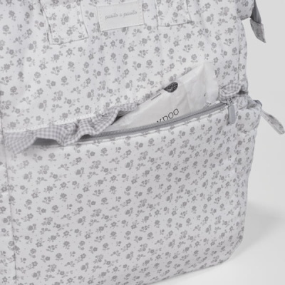 Bolsa têxtil branca com padrão floral e bolso com fecho