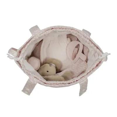 Mala rosa com brinquedo de pelúcia, peça de roupa e brinquedo de silicone dentro