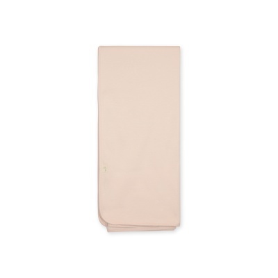 Tecido ou colcha rosa claro dobrado com etiqueta