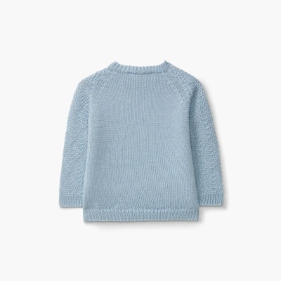 Camisola azul bebé de malha com mangas trançadas vista de costas