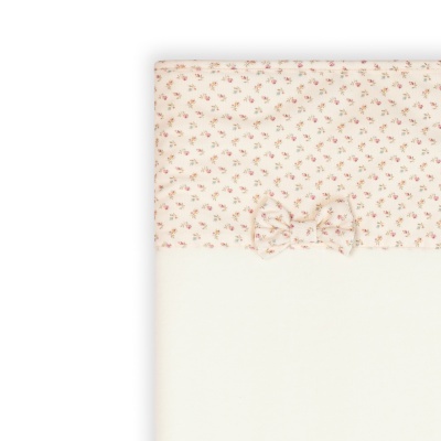 Manta creme com padrão floral e laço frontal