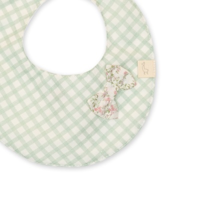 Babete redondo com padrão às quadrículas e laço floral