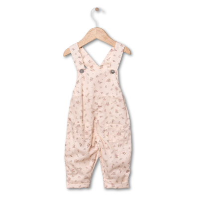 Macacão para bebé com padrão floral em fundo bege claro com bolso e alças cruzadas