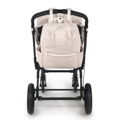 Carrinho de bebé com mochila bege floral presa