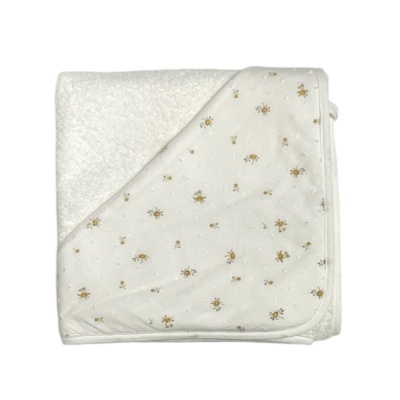 Manta branca de bebé com desenhos de flores amarelas e castanhas