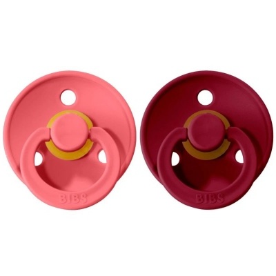 Duas chupetas BIBS rosa e vinho com anilha amarela