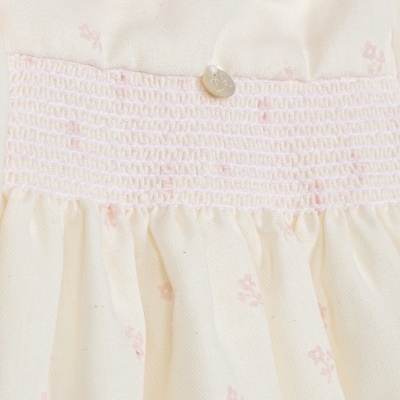 Vestido infantil creme com detalhes em cor-de-rosa e botão Dk