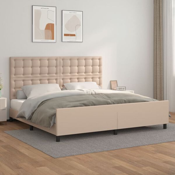 Cama de casal bege estofada com roupa de cama cinza e branca em quarto minimalista