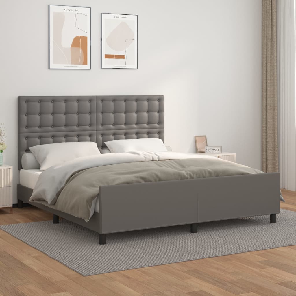 Cama cinzenta com cabeceira acolchoada em quarto moderno com decoração minimalista