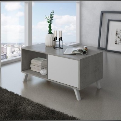 Mesa de centro cinzenta com porta branca, vaso, castiçal e revista