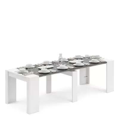 Mesa extensível preta e branca com serviço de cozinha branco e copos