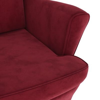 Sofá vermelho de tecido suave com costuras e apoios arredondados