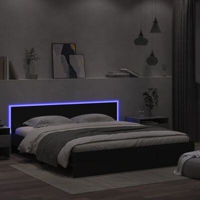 Cama de casal preta com cabeceira iluminada em quarto minimalista cinzento
