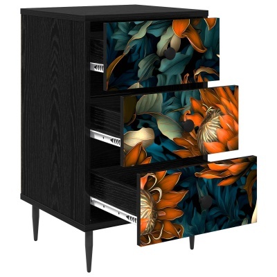 Móvel preto com três gavetas decoradas com estampas florais coloridas