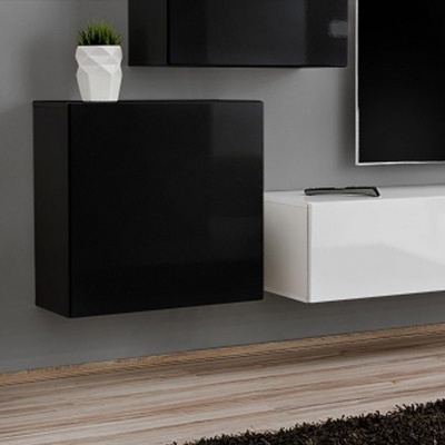 Móveis de parede suspensos pretos e brancos com vaso branco e planta artificial numa parede cinza.