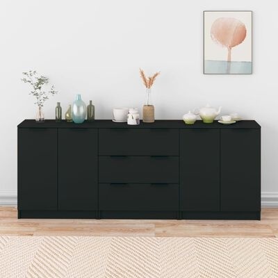 Aparador preto com vasos decorativos e quadro na parede branca