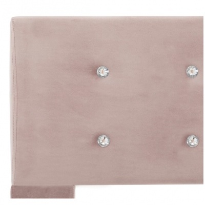 Cabeceira de cama rosa claro com botões decorativos brilhantes