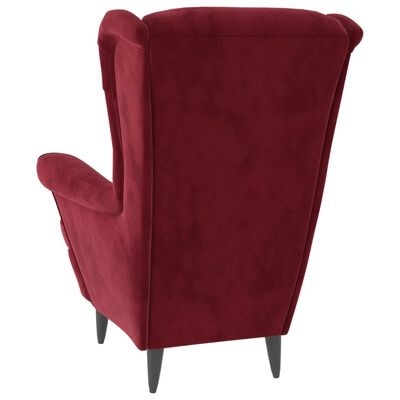 Poltrona de veludo vermelho com encosto alto e pés de madeira escura