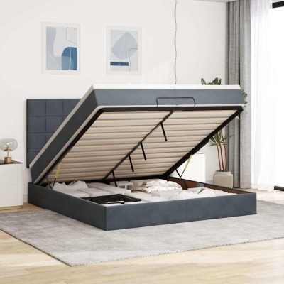 Cama cinzenta articulada com arrumação interior num quarto moderno.