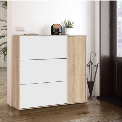 Móvel de arrumação de madeira clara com gavetas brancas e porta de armário, com planta e porta-chaves no topo, e suporte para guarda-chuvas ao lado