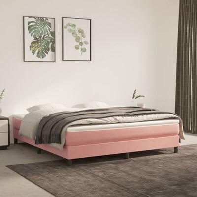 Cama de casal estofada rosa clara com roupa de cama branca e manta cinza numa divisão moderna