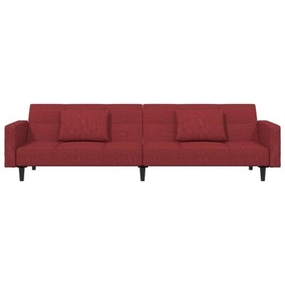 Sofá modular vermelho com almofadas e pernas pretas