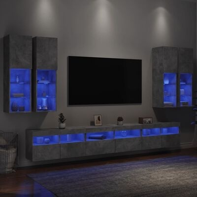 Conjunto móveis sala estar cinza escuro com iluminação azul LED e TV preta na parede cinza