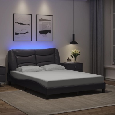 Cama preta em quarto moderno com luz ambiente e decoração minimalista.