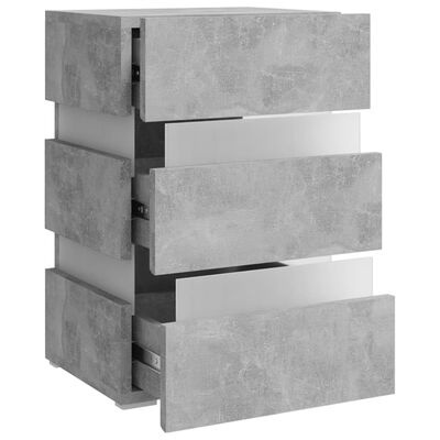 Comoda cinza com três gavetas abertas