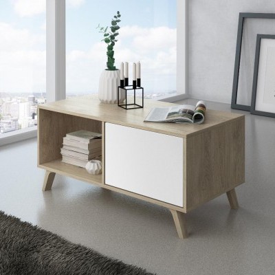 Mesa de centro em madeira clara com porta branca e decoração de vaso, velas e livros num ambiente moderno