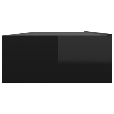 Caixa preta retangular com acabamento brilhante sobre fundo branco.