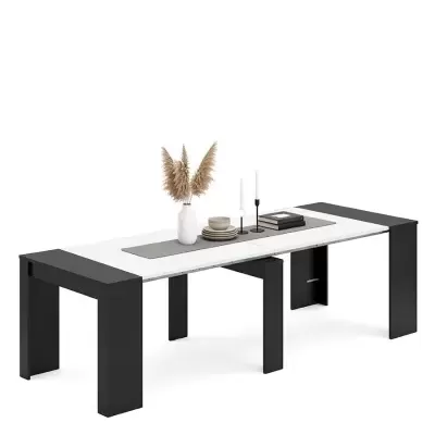 Mesa extensível branca com pernas pretas e decoração minimalista