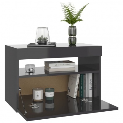 móvel de apoio cinza escuro com livros, velas e vaso com planta