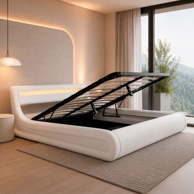 Cama branca com base elevável para arrumação num quarto moderno e iluminado