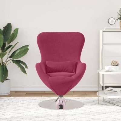 Cadeira cor de vinho sobre base metálica num ambiente decorado com plantas, mesa e móvel branco