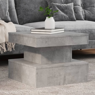 Mesa de centro de concreto cinza quadrada com design em três níveis, em sala com sofá cinza e tapete cinza claro