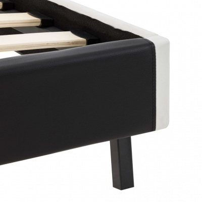 Canto de cama com estrutura preta e branca e pernas pretas