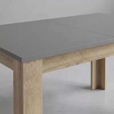 Mesa com tampo cinzento e estrutura de madeira