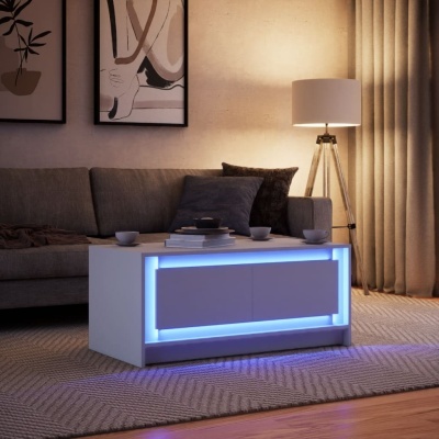 Mesa de centro branca com iluminação LED azul e sofá cinza em sala de estar moderna